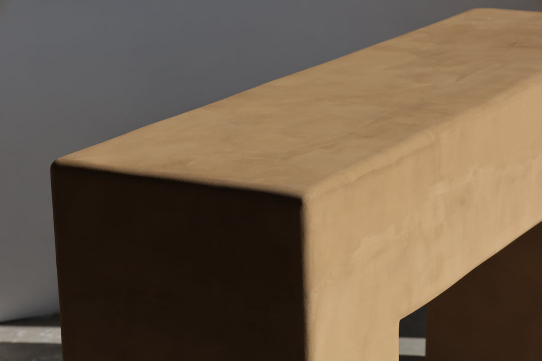 brutalist console table in rammed earth